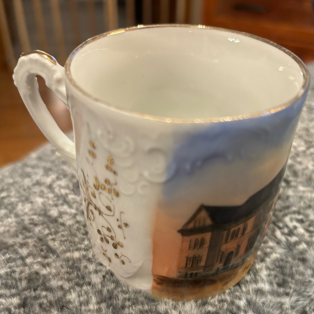 Moulton Iowa High School souvenir porcelain cup. It is smaller than a coffee cup